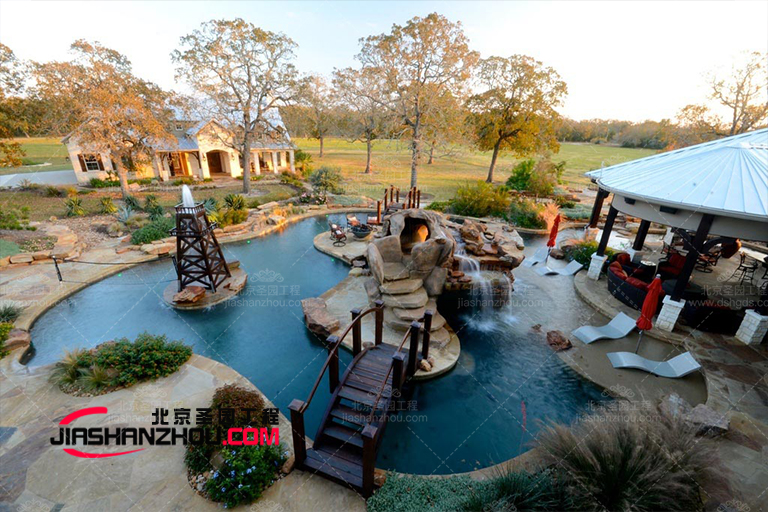 深圳純水岸帶涼棚休息區的塑石假山景觀別墅庭院設計